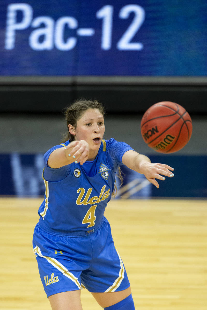 UCLA Bruins guard Lindsey Corsaro (4) passes during the first half of an NCAA college basketbal ...