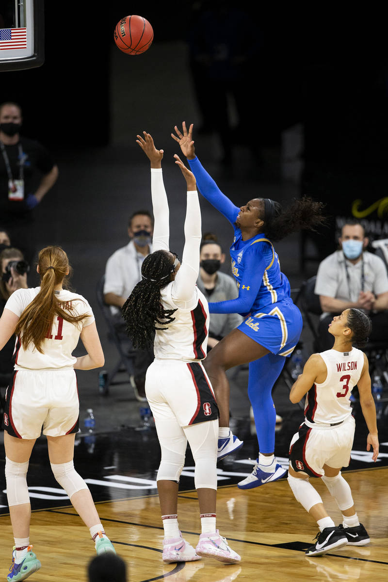 UCLA Bruins forward Michaela Onyenwere (21) attempts a point while Stanford Cardinal forward Fr ...