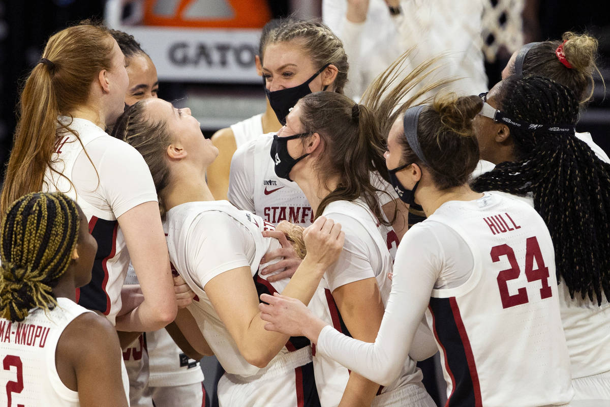 The Stanford Cardinal celebrate after winning the championship NCAA college basketball game at ...