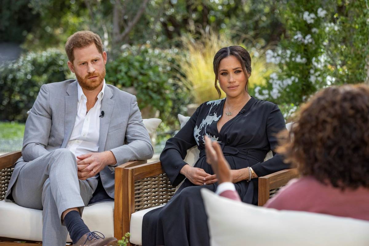 Prince Harry, left, and Meghan, Duchess of Sussex, talk with Oprah Winfrey. (Joe Pugliese/Harpo ...