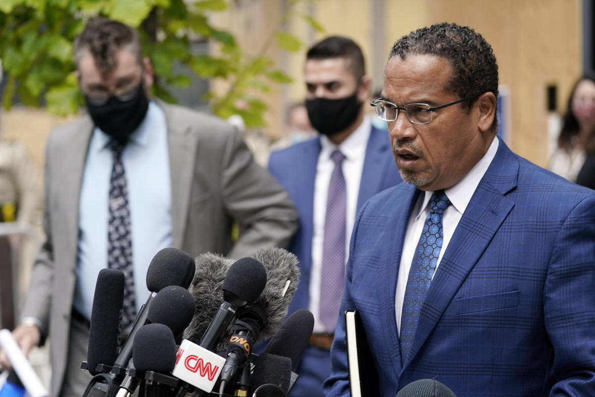 FILE - In this Sept. 11, 2020 file photo, Minnesota Attorney General Keith Ellison, right, addr ...