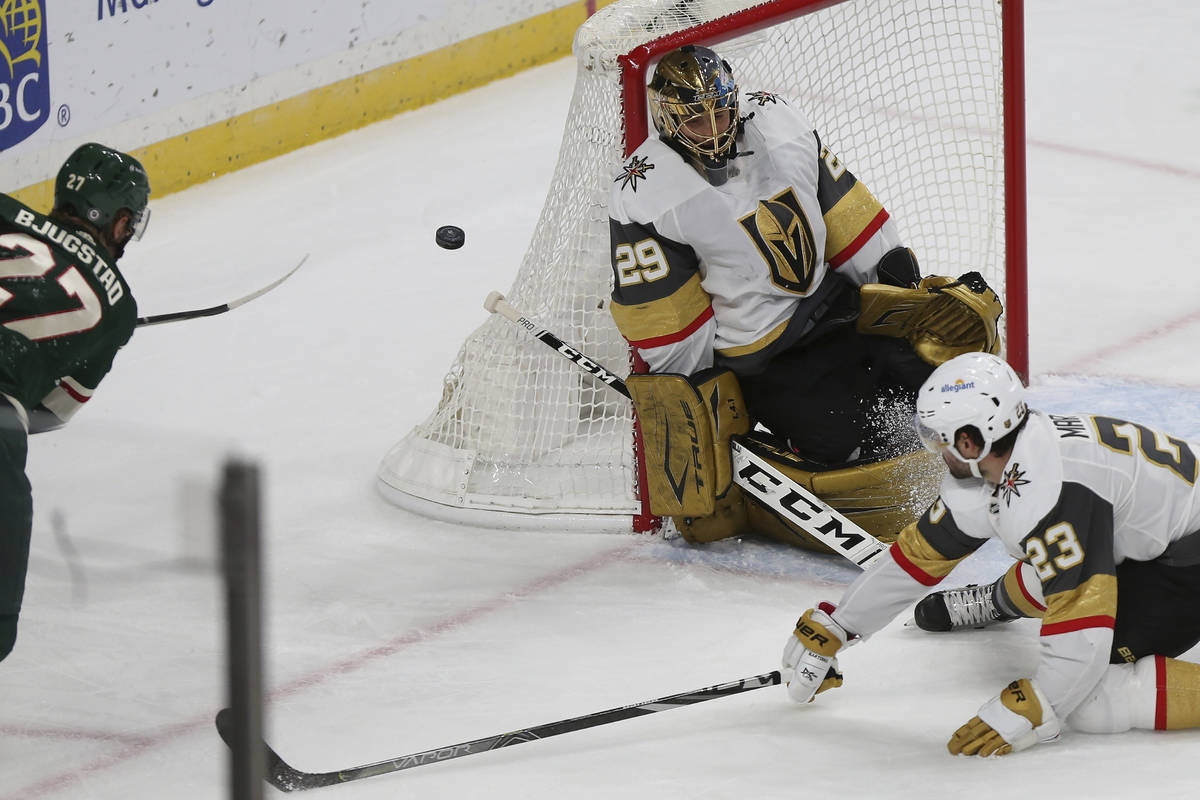 Vegas Golden Knights goalie Marc-Andre Fleury (29) blocks the puck with his body after Minnesot ...