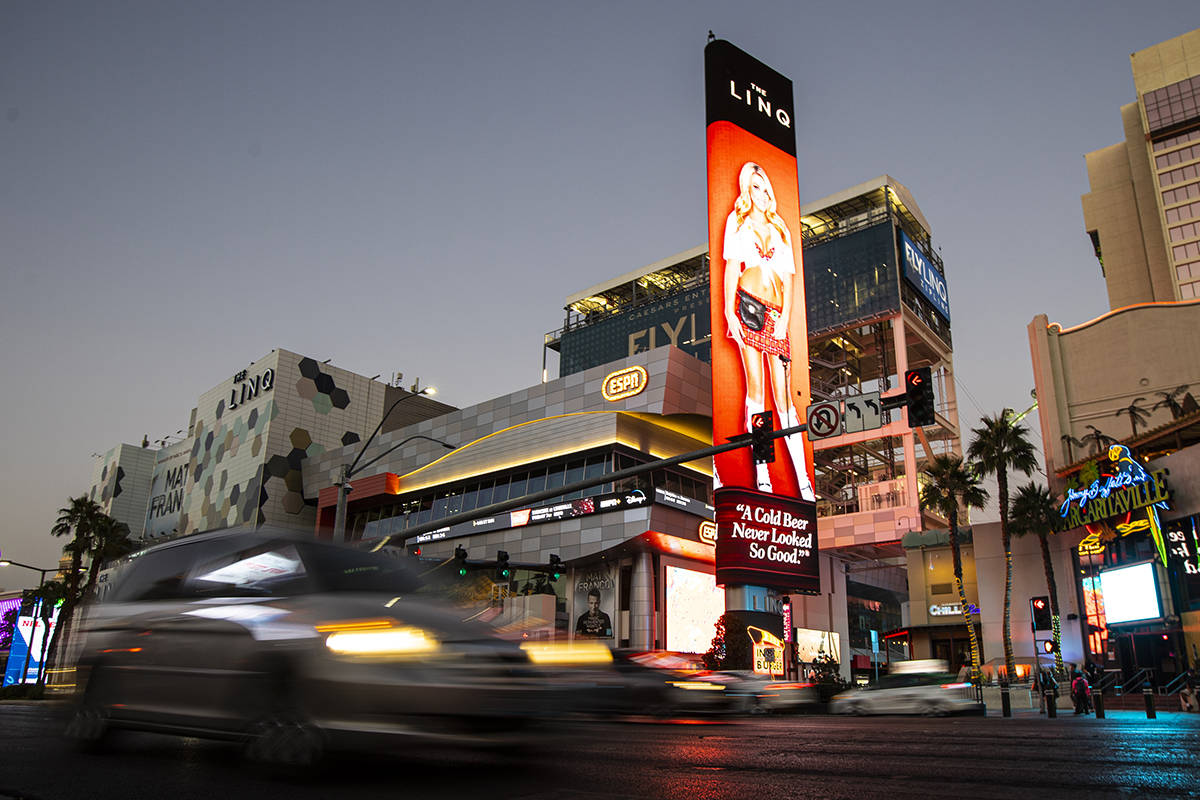 Traffic passes outside of The Linq Hotel along the Las Vegas Strip Thursday, Nov. 19, 2020. (Ch ...