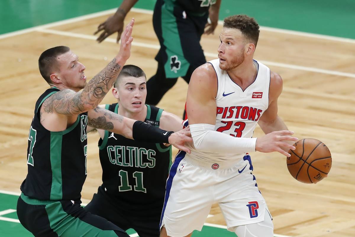 Boston Celtics' Daniel Theis (27) and Payton Pritchard (11) defend against Detroit Pistons' Bla ...