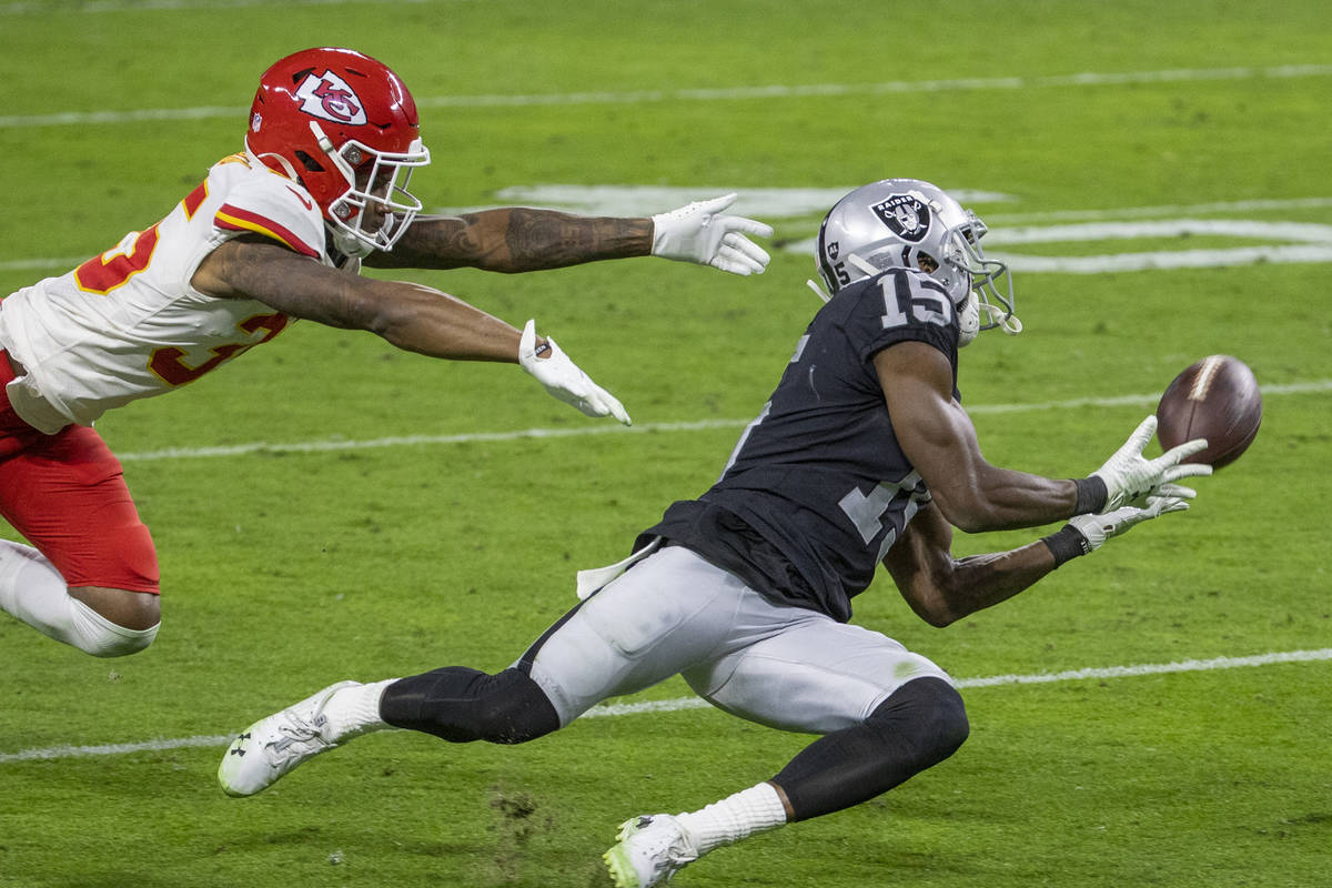 Las Vegas Raiders wide receiver Nelson Agholor (15) makes a diving attempt at a long pass as Ka ...