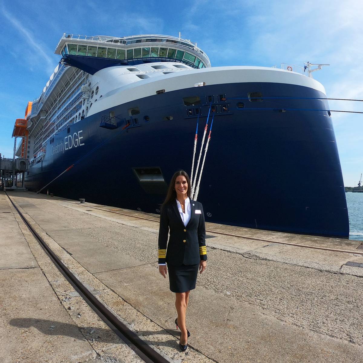 Capt. Kate McCue stands in front of the Celebrity Edge. (Kate McCue)