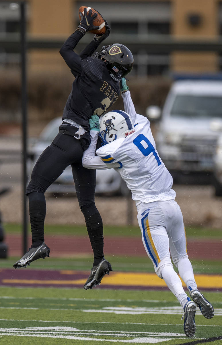 Faith LutheranÕs Jaden Rhodes (2) intercepts a long pass to Moapa ValleyÕs Austin Hei ...