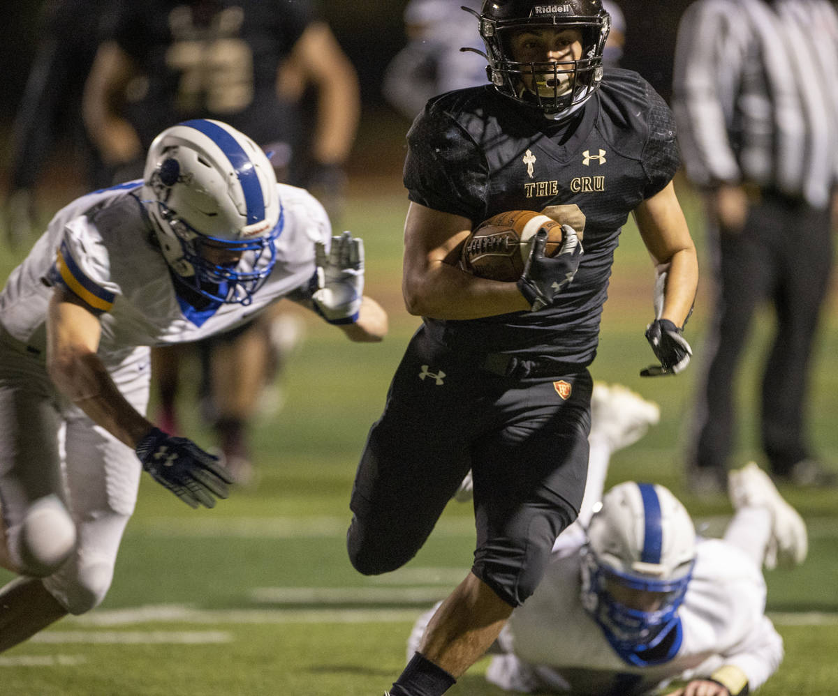 Faith LutheranÕs Marcos Canales (9) heads for the end zone again on a long run over the Mo ...