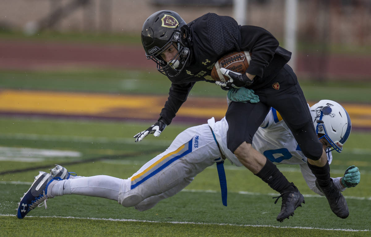 Faith LutheranÕs Landon Wrzesinski (10) breaks a tackle after a catch over Moapa Valley&#x ...