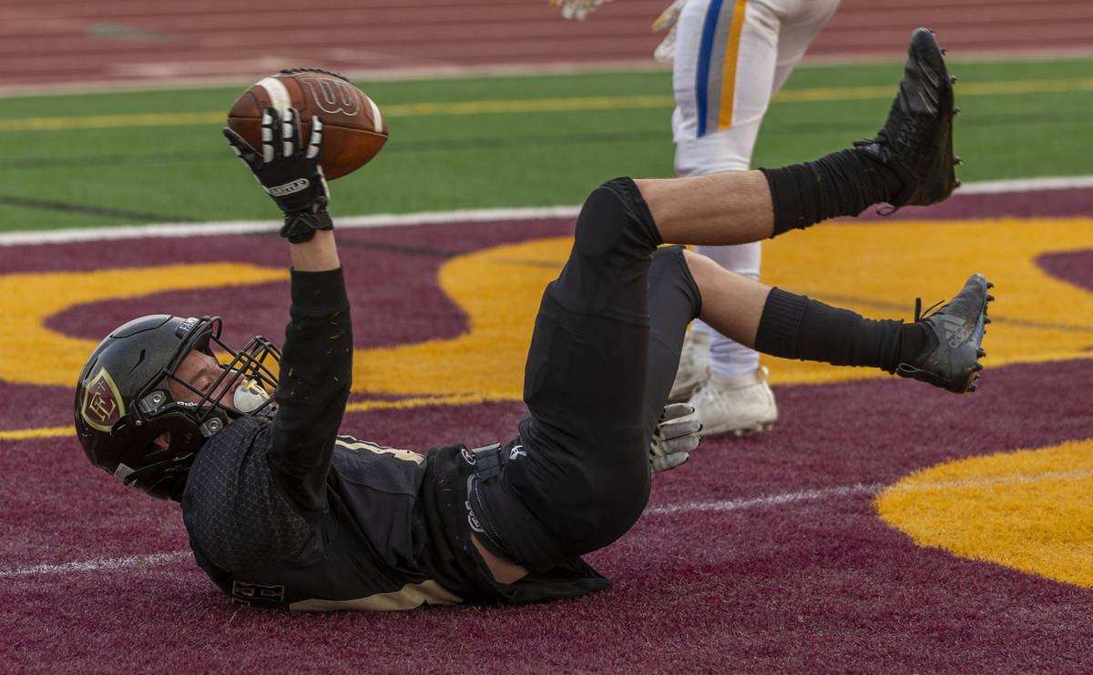 Faith LutheranÕs Landon Wrzesinski (10) celebrates a touchdown catch over Moapa Valley dur ...