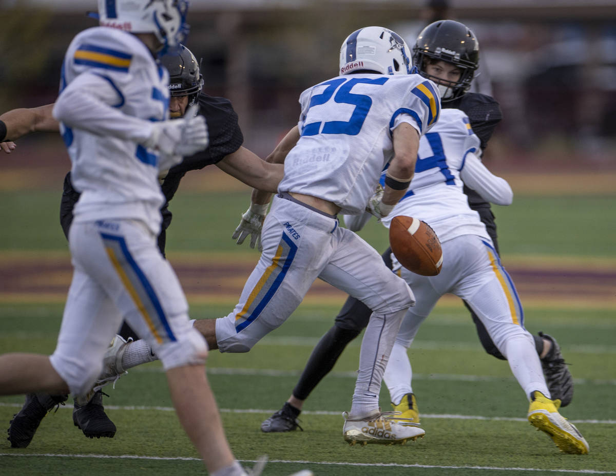 Moapa ValleyÕs Jayme Carvajal (25) fumbles the ball versus Faith Lutheran during the first ...