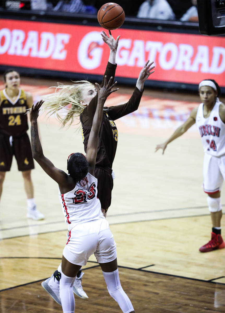 Wyoming'forward Dagny Davidsdottir (33) shoots a basket past UNLV center Desi-Rae Young (23) in ...