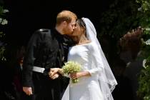 FILE - In this Saturday, May 19, 2018 file photo, Britain's Prince Harry and Meghan Markle leav ...