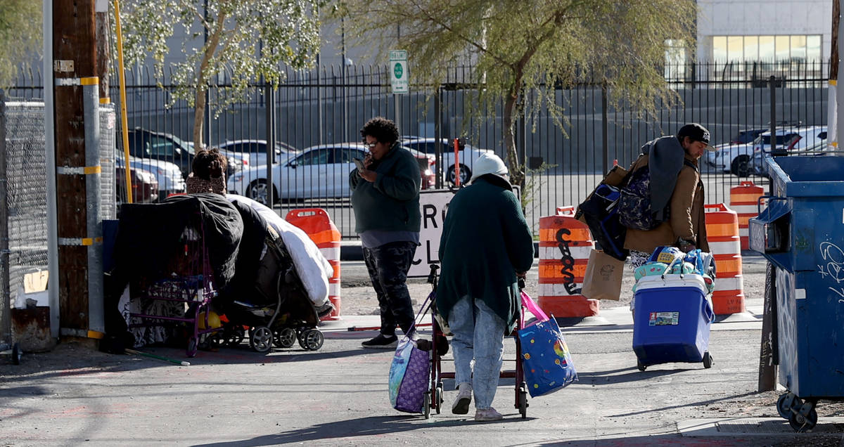 People visit on Carson Avenue near Las Vegas Boulevard in downtown Las Vegas Tuesday, March 9, ...