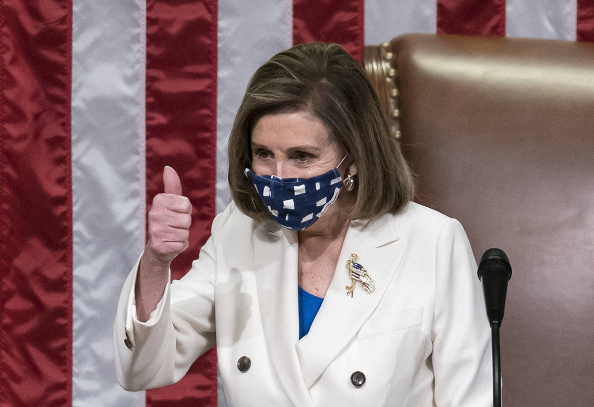 Speaker of the House Nancy Pelosi, D-Calif., leads the vote to approve a landmark $1.9 trillion ...