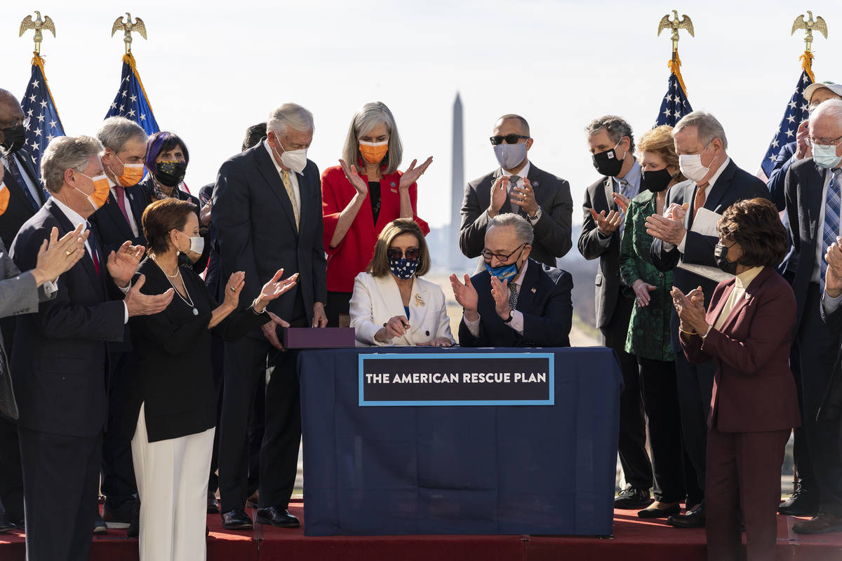 House Speaker Nancy Pelosi of Calif., and Senate Majority Leader Chuck Schumer of N.Y., celebra ...