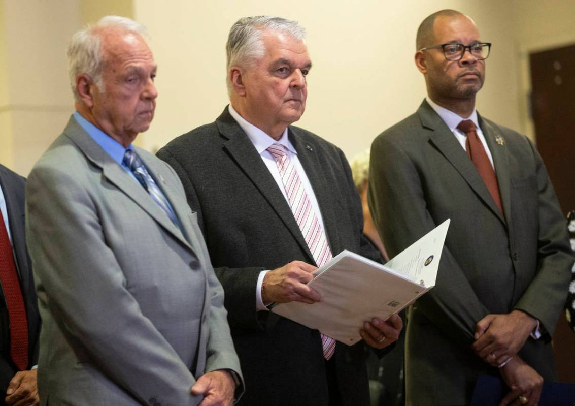 Dr. John Novak, left, District Board of Health Chair, Governor Steve Sisolak and Attorney Gener ...