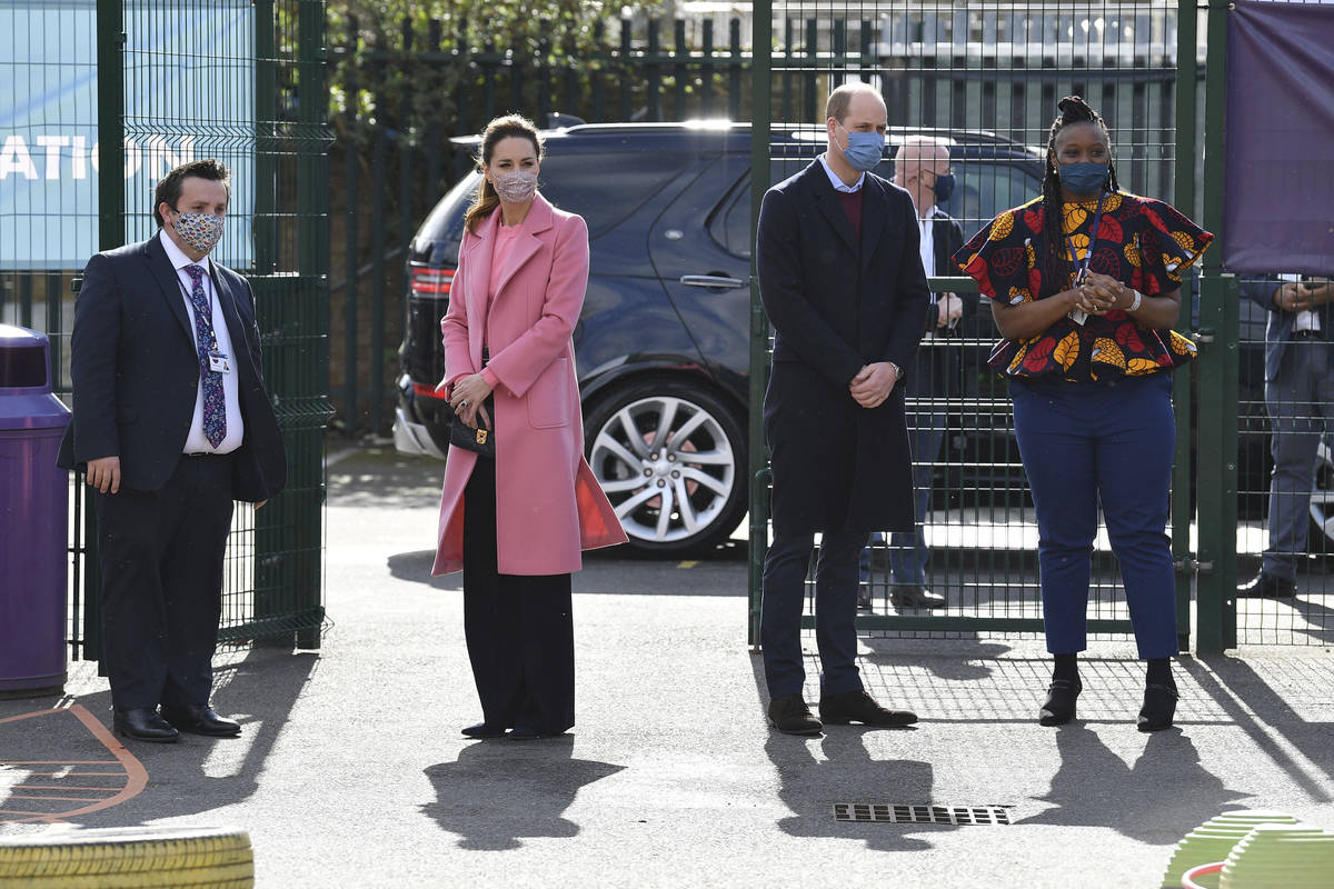 Britain's Prince William and Kate, Duchess of Cambridge arrive for a visit to School21, a secon ...
