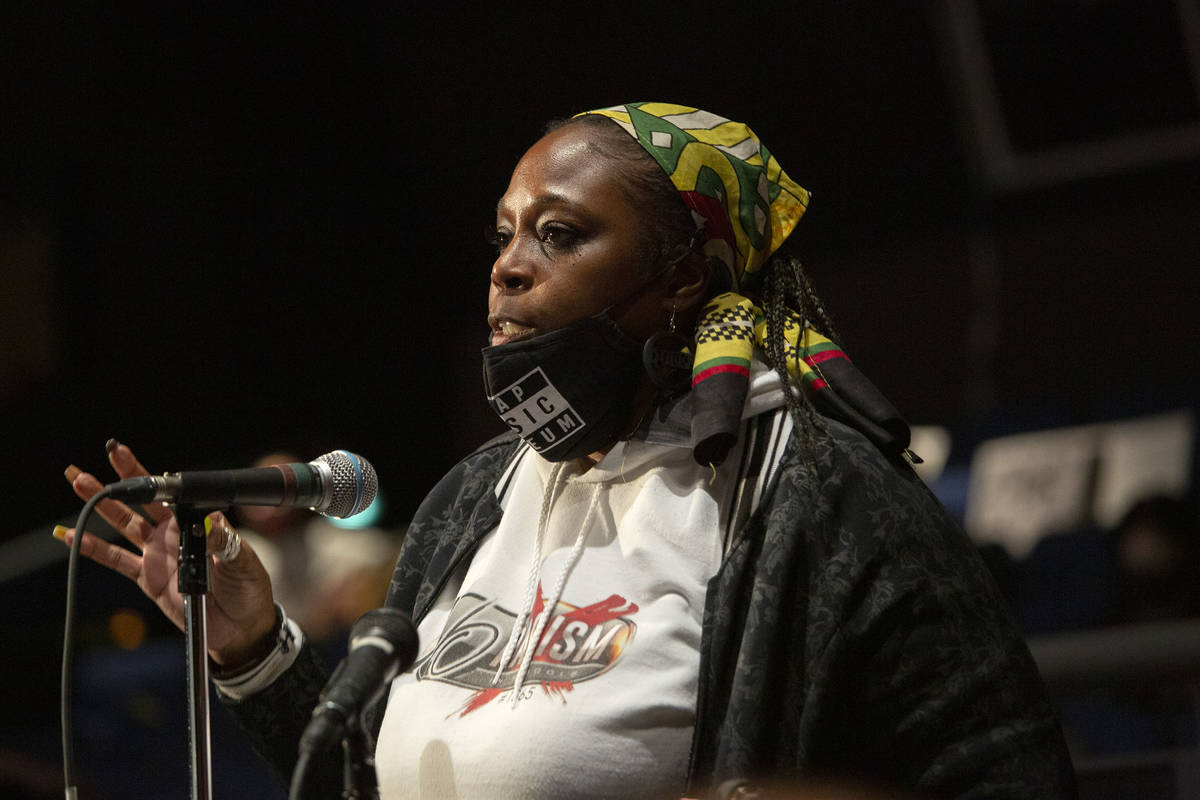Akiko Cooks, with group No Racism in Schools #1865, speaks during the public comment period of ...