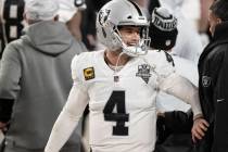 Raiders quarterback Derek Carr (4) celebrates after converting the winning two point conversion ...