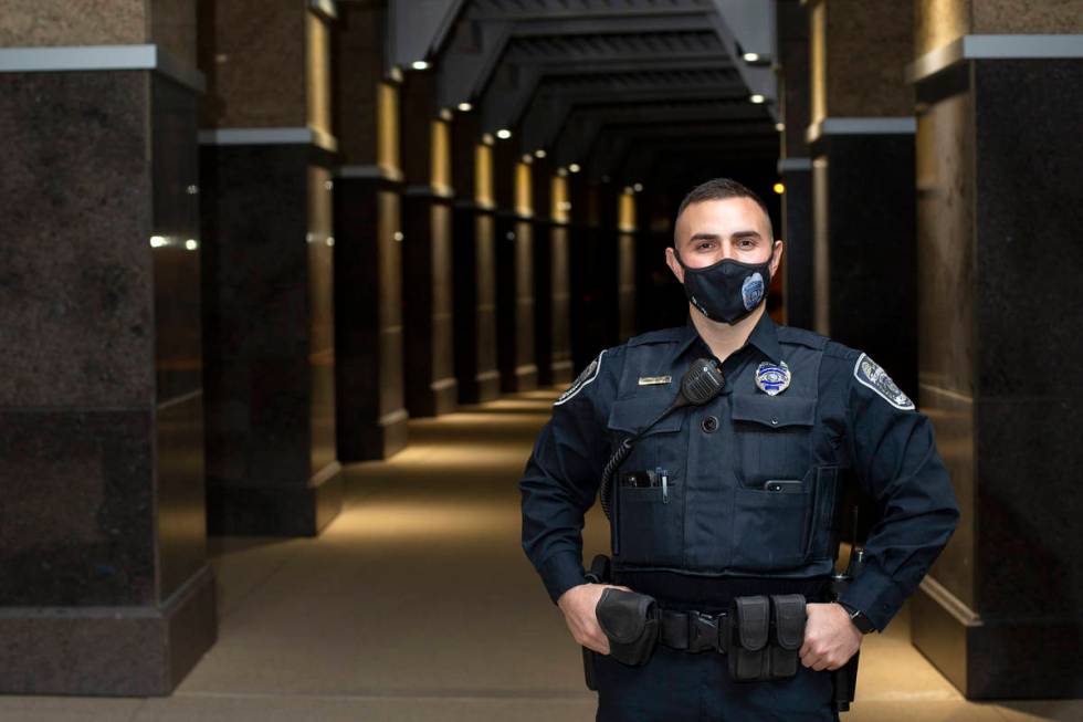 North Las Vegas police officer Alexander Cuevas poses for a portrait outside North Las Vegas Ci ...