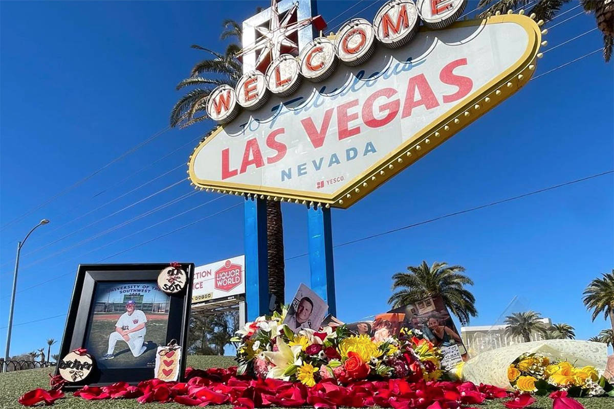 A floral arrangement is displayed at the famous Welcome to Las Vegas sign on March 1, 2021, in ...