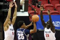 Nevada guard Grant Sherfield (25) passes as San Diego State forward Matt Mitchell (11) and forw ...