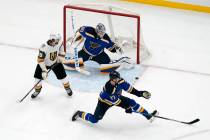 Vegas Golden Knights' Alex Tuch (89) watches as the game-winning goal by teammate Reilly Smith, ...