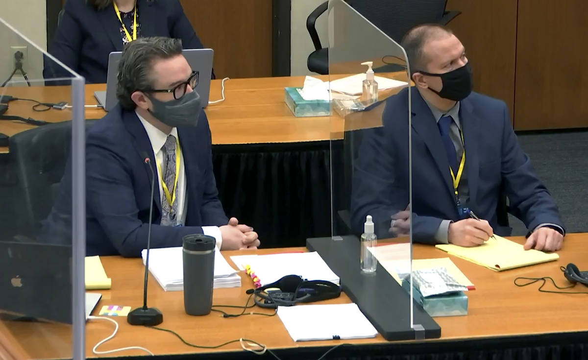 In this image taken from video, defense attorney Eric Nelson, left, and defendant, former Minne ...