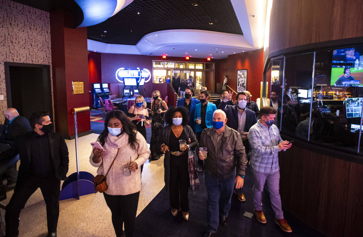 People head to the casino floor at Circa as it opens to the public just after midnight in downt ...