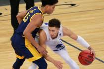 UC Santa Barbara's JaQuori McLaughlin (3) keeps possession of the ball from UC Irvine's Jeron A ...