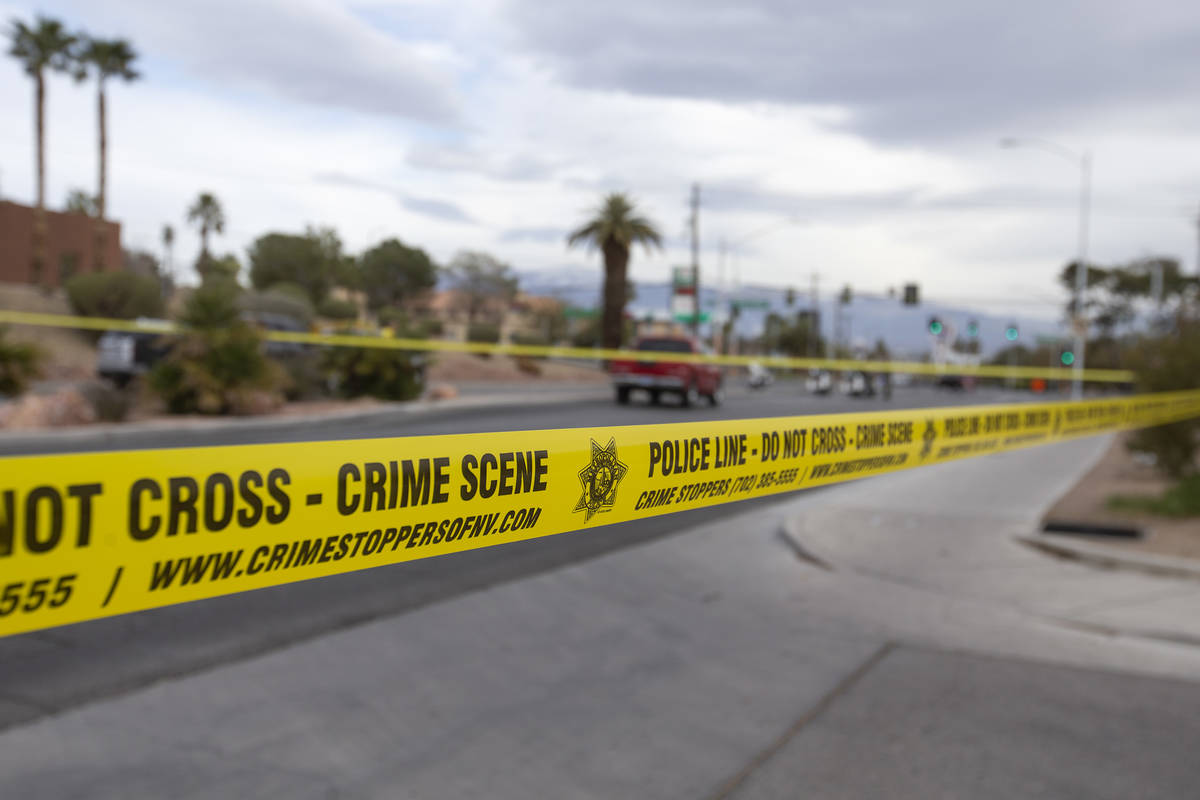 Metropolitan police blocked off the scene a crash involving two vehicles and a pedestrian at th ...