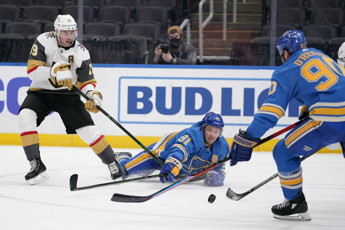 Vegas Golden Knights' Reilly Smith (19) watches as St. Louis Blues' Vladimir Tarasenko (91) and ...