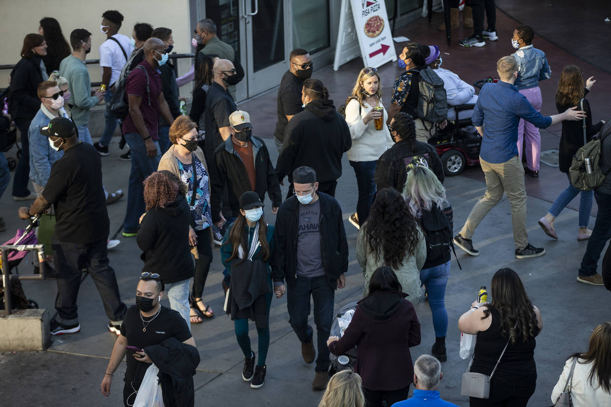 People visit the Strip near the Paris Las Vegas in Las Vegas, on Saturday, March 13, 2021. (Eri ...