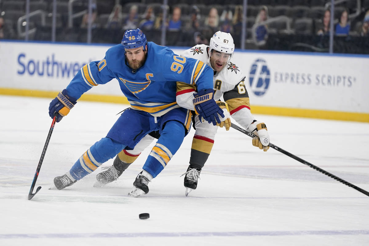 St. Louis Blues' Ryan O'Reilly (90) and Vegas Golden Knights' Max Pacioretty (67) battle for a ...