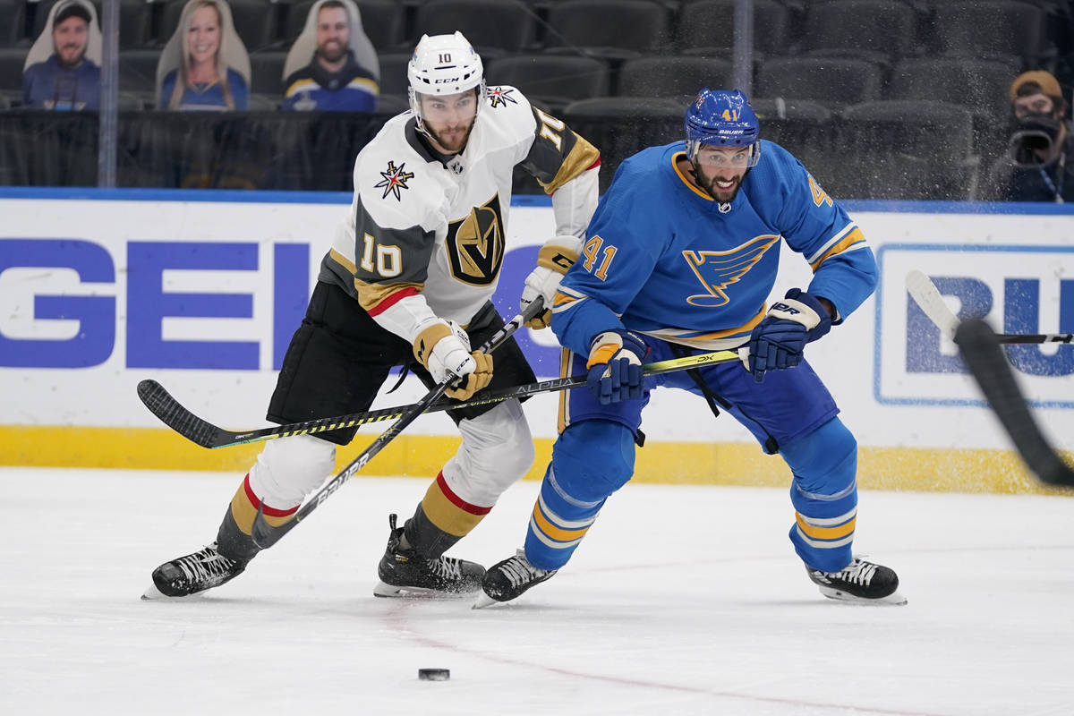 St. Louis Blues' Robert Bortuzzo (41) and Vegas Golden Knights' Nicolas Roy (10) chase after a ...