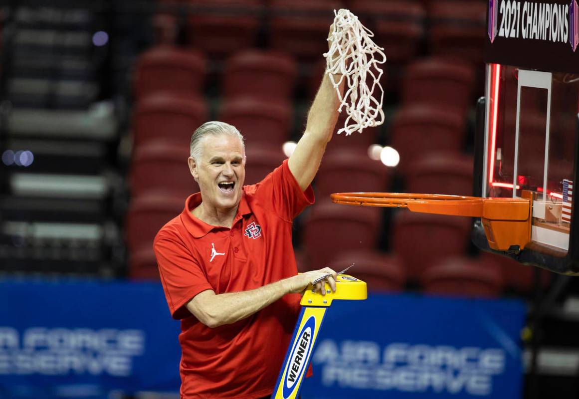 San Diego State Aztecs head coach Brian Dutcher celebrates after winning the Mountain West conf ...