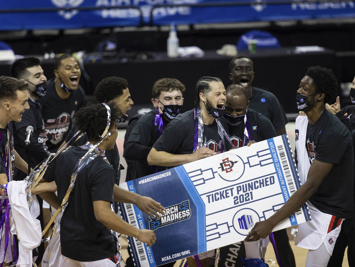 San Diego State Aztec players celebrates after winning the Mountain West conference men's colle ...