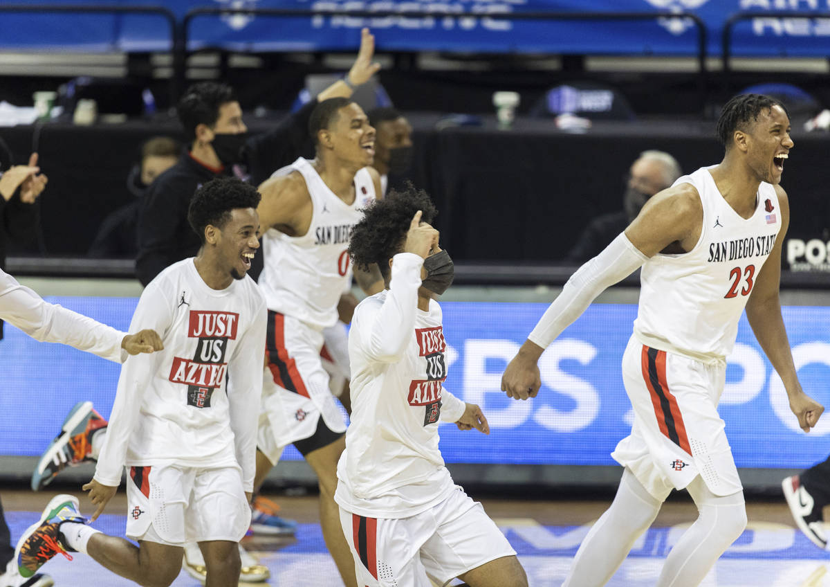 San Diego State Aztec players celebrates after winning the Mountain West conference men's colle ...