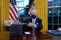 President Joe Biden signs his first executive orders. (AP Photo/Evan Vucci, File)