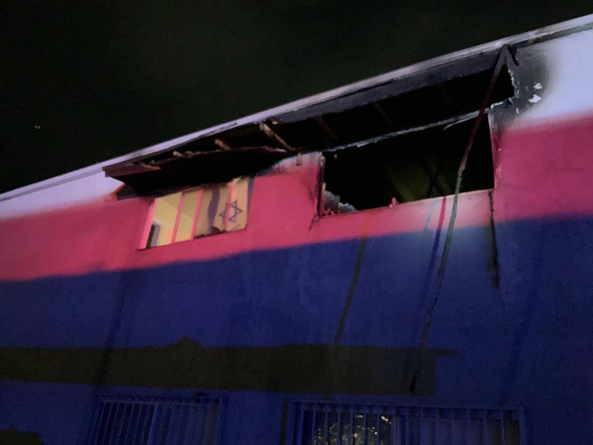 Smoke and flames were coming from a second-story window when Las Vegas firefighters arrived at ...