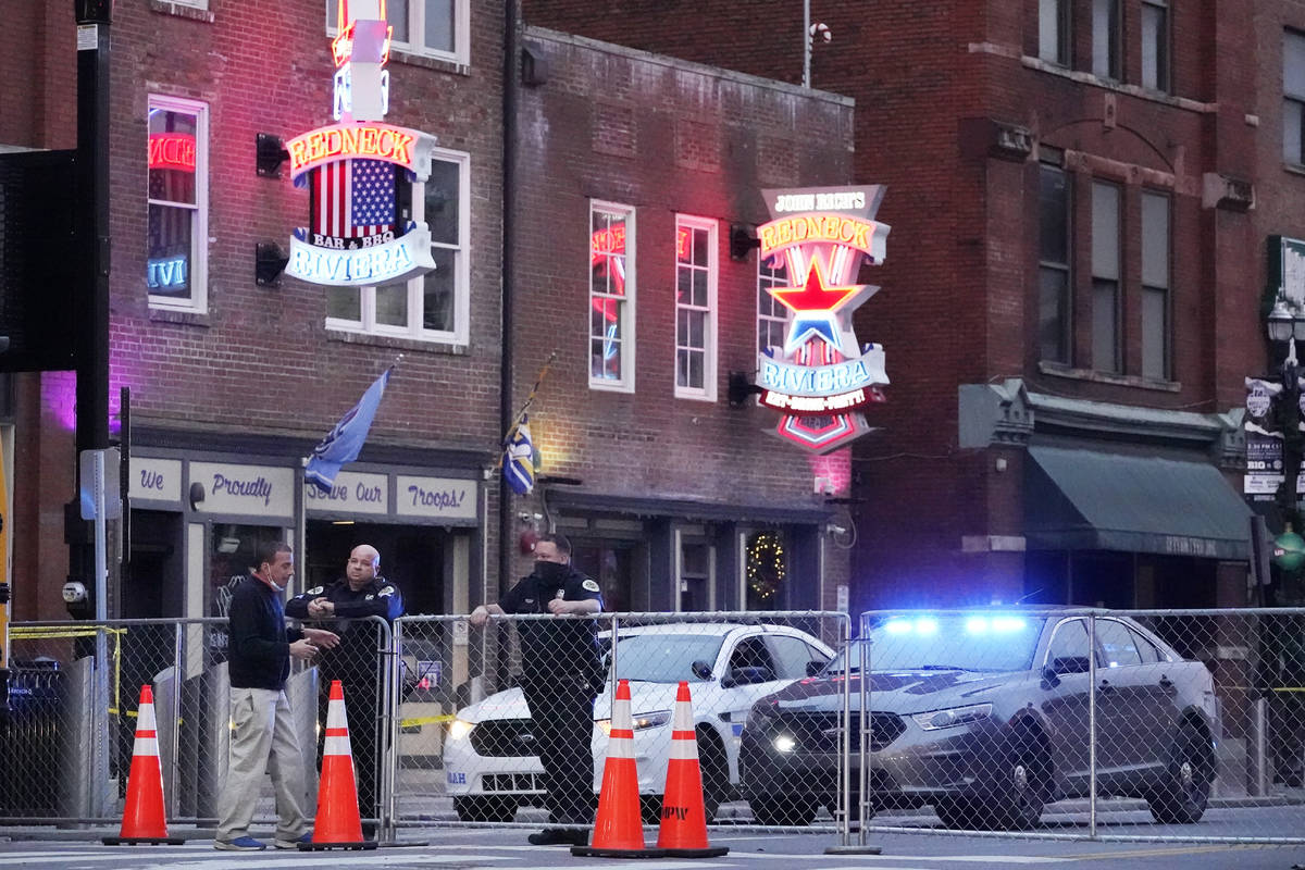 In this Dec. 28, 2020, file photo, police block off a part of the Broadway tourist district as ...
