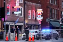 In this Dec. 28, 2020, file photo, police block off a part of the Broadway tourist district as ...
