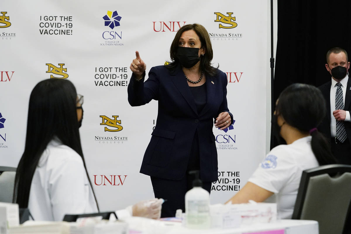 Vice President Kamala Harris looks over a vaccination site at the University of Nevada in Las V ...