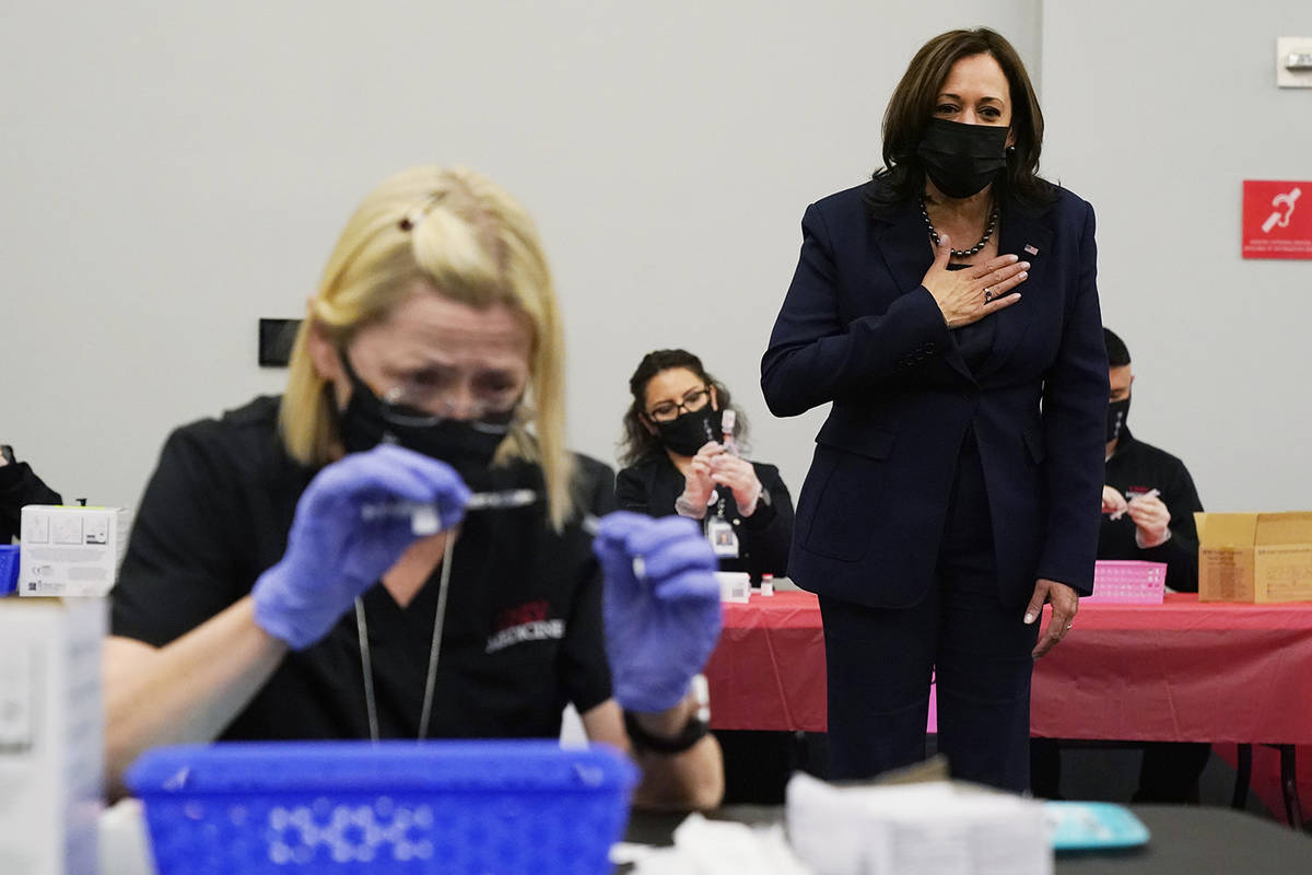 Vice President Kamala Harris looks over a vaccination site at the University of Nevada in Las V ...