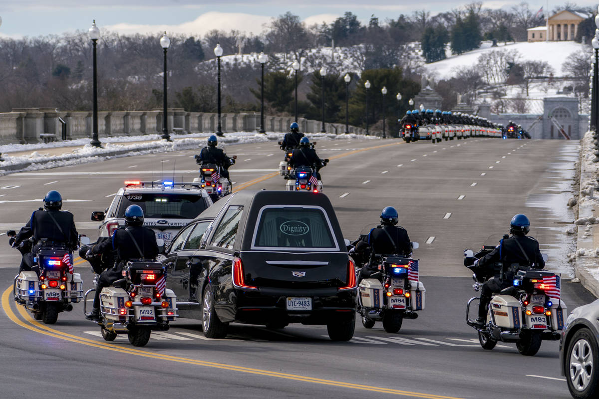 FILE - In this Feb. 3, 2021 file photo, a hearse carrying the remains of U.S. Capitol Police of ...