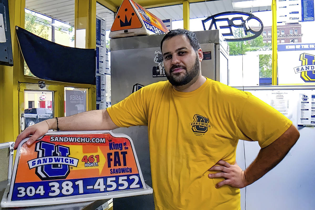 FILE - This April 2017, file photo photo shows George Tanios at his sandwich shop in Morgantown ...
