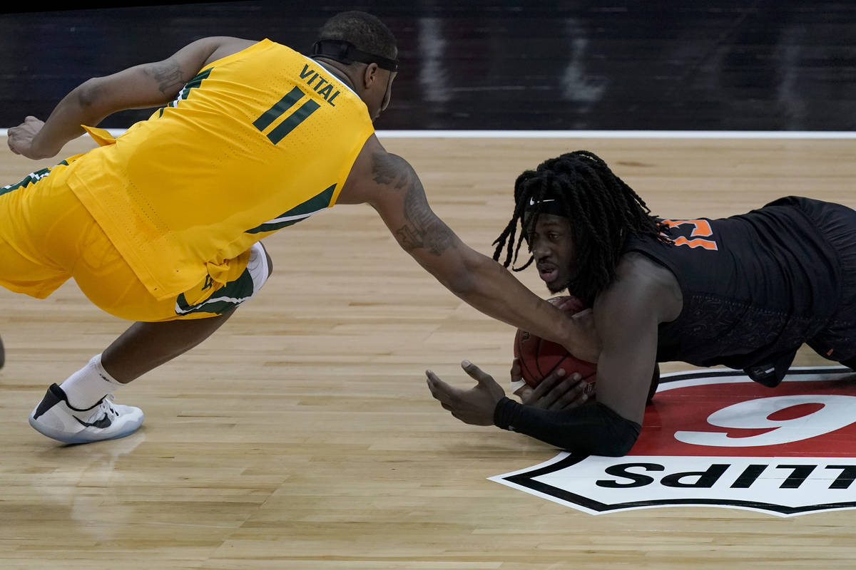 Baylor's Mark Vital (11) tries to steal the ball from Oklahoma State's Isaac Likekele during th ...