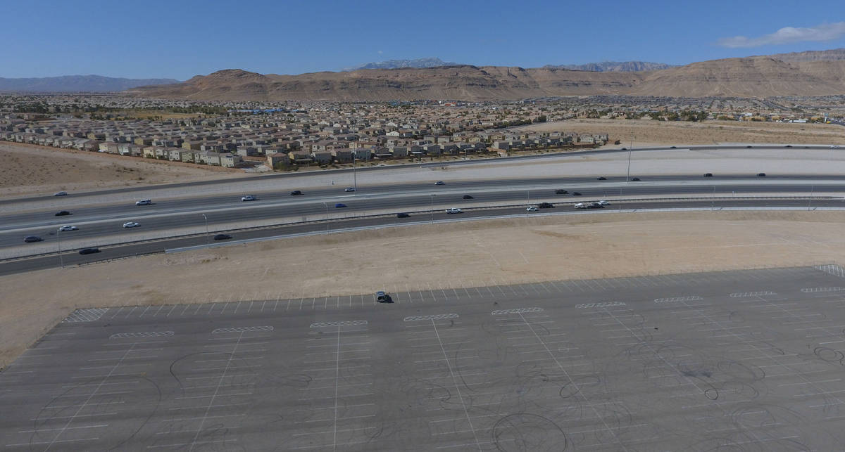 A swath of land where Ashley Furniture will set out to build a big store at Sunset Road just ea ...