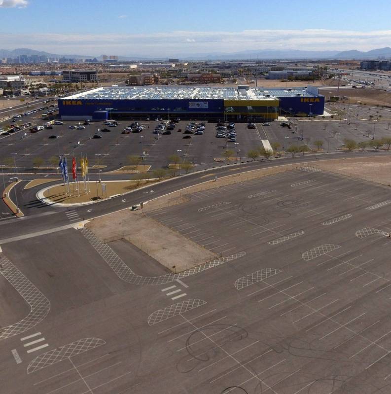A swath of land where Ashley Furniture will set out to build a big store at Sunset Road just ea ...
